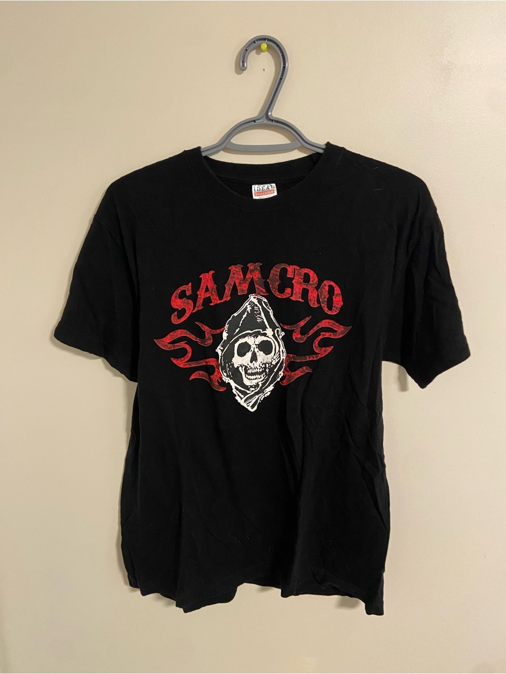 Supreme Black Graphic Tee with Red and White Skull Print